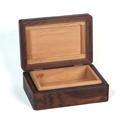 A rectangular cigar humidor with an open lid, featuring a dark brown walnut-look exterior and a lighter natural wood interior, shown on a white background.