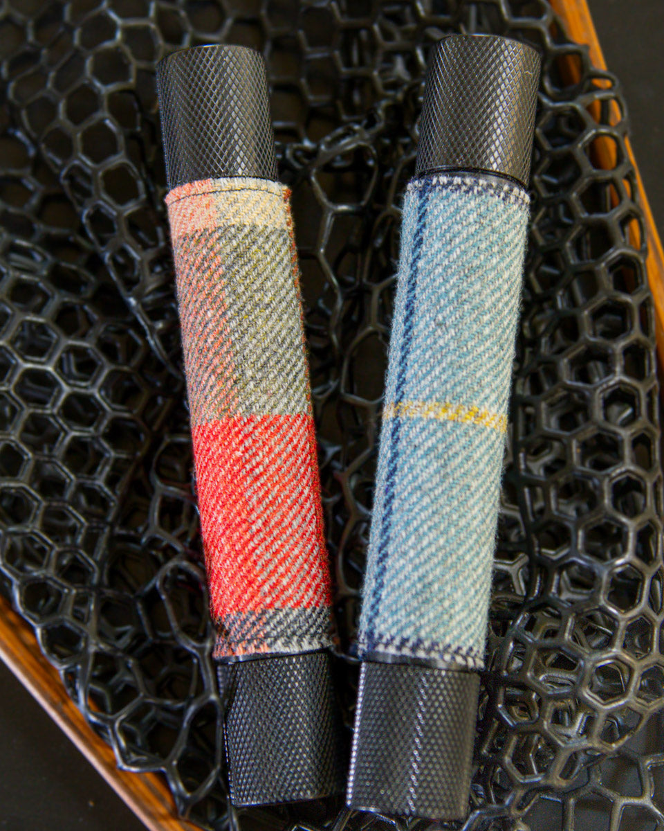 Waterproof cigar tubes in a fly fishing net.